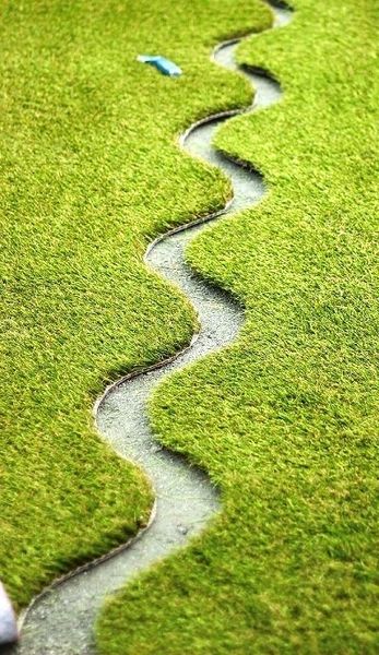 A close up of grass with water running down it
