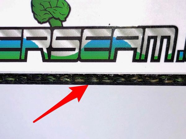 A close up of the logo on a sticker