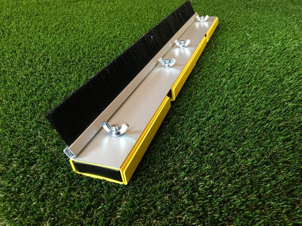 A yellow and black box on the grass