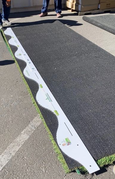 A sidewalk with a green line on it.